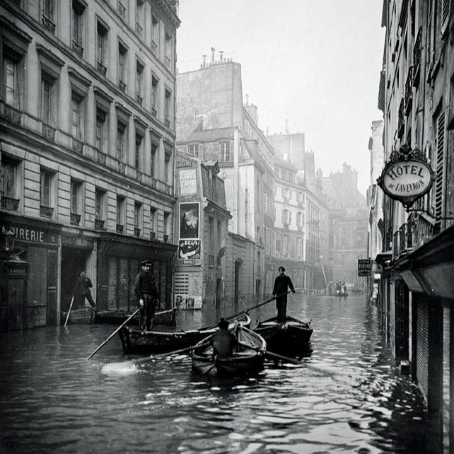 Paris flooding, 1910. Boats on a submerged Parisian street.
