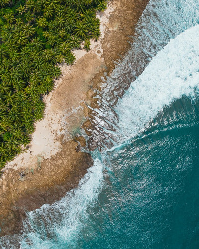 Coastline and breaking wave, aerial, Indonesia